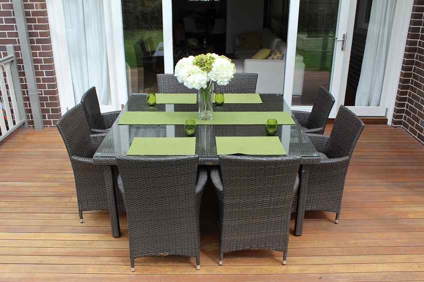 Black/grey wicker chairs and table outside